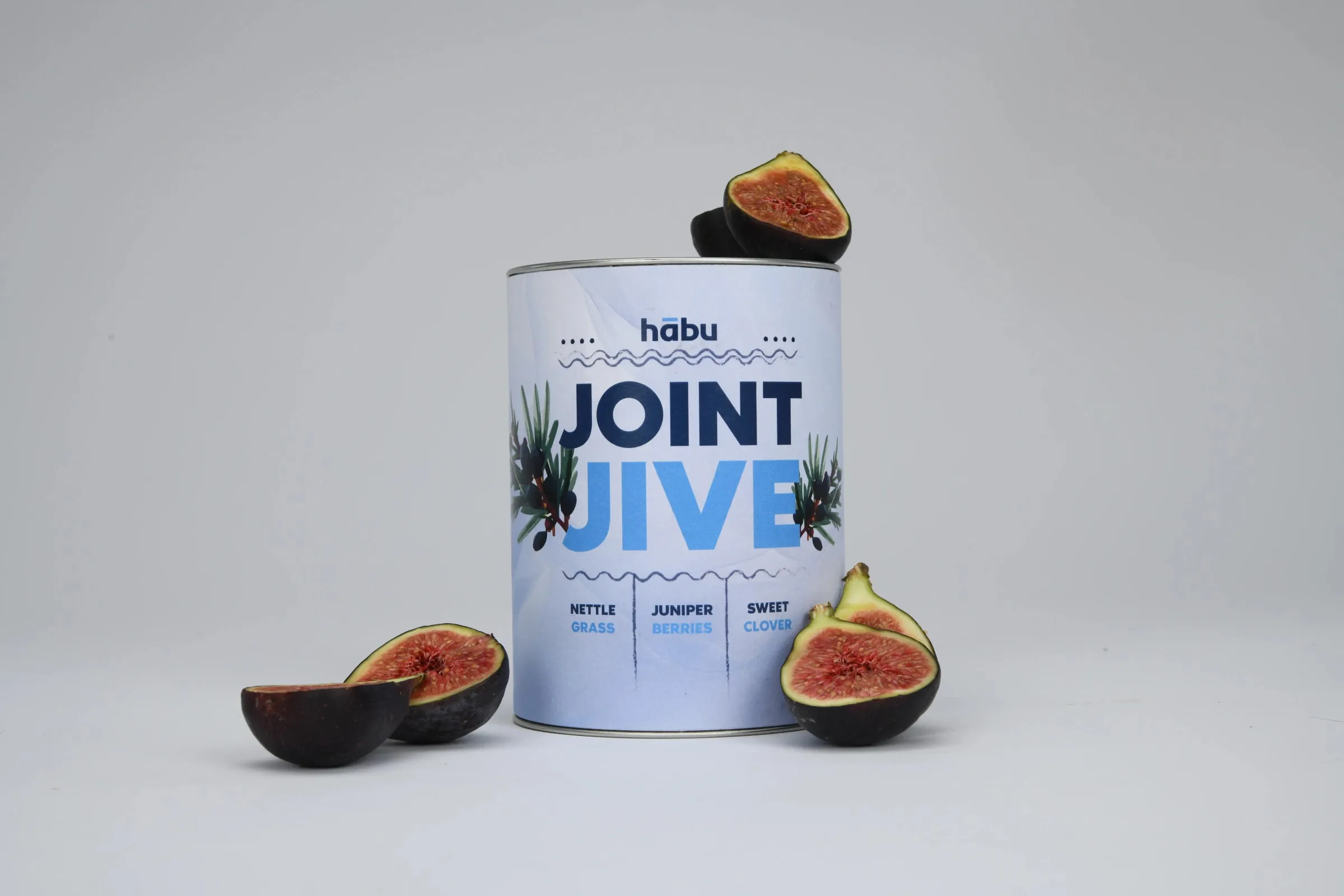 A Joint Jive tin with halved figs around it.